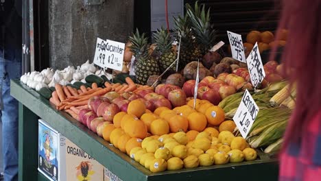 a colorful table of fruit and vegetables for sale in the famous pike place farmers market in the middle of seattle, washington