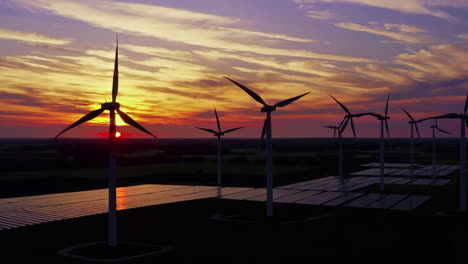 sunset over wind and solar farm