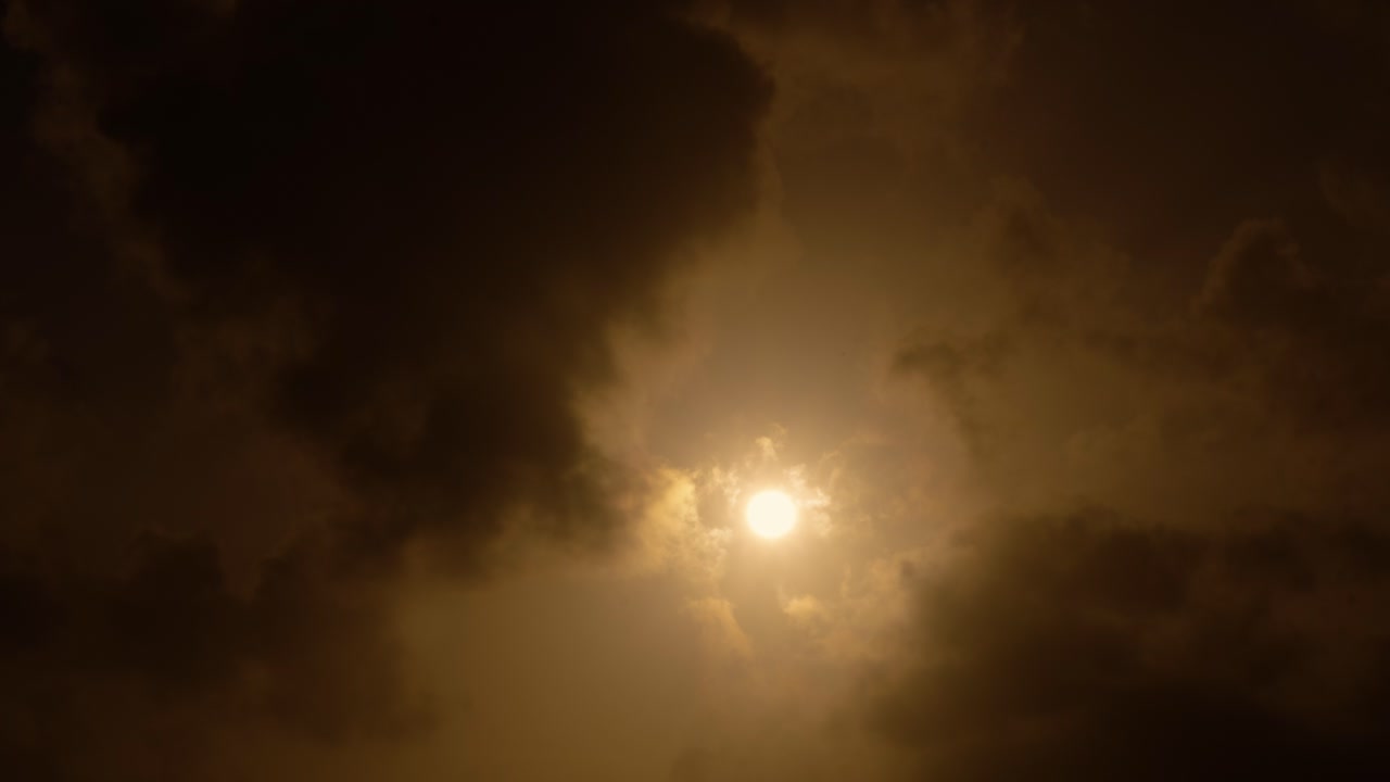 Sun Shining Through Dark Clouds
