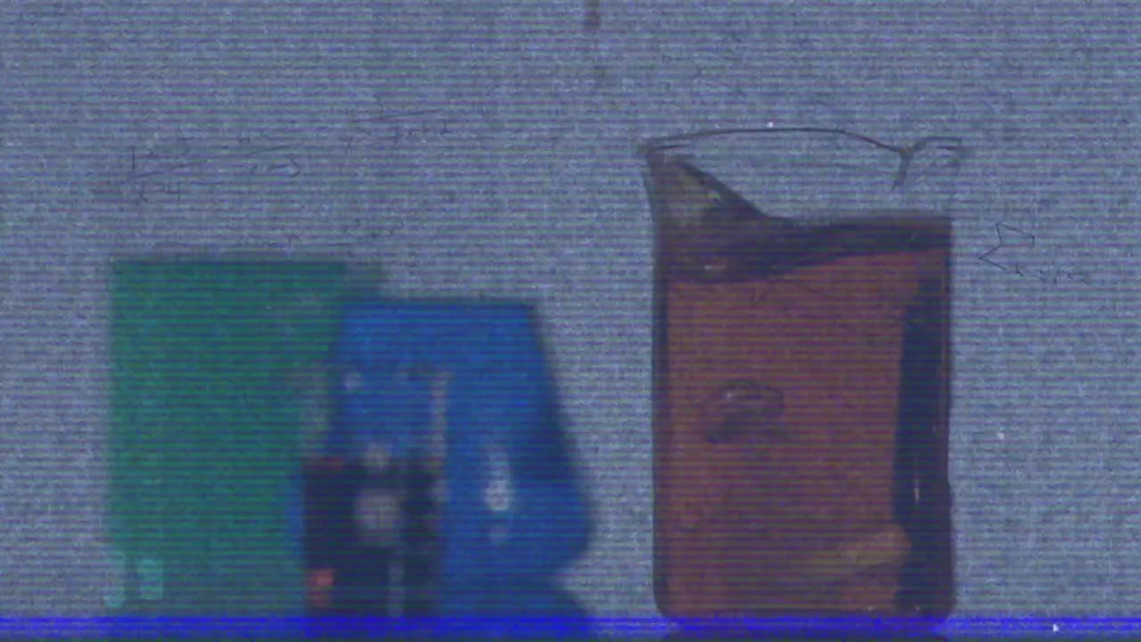 On clip start beaker holding brown liquid rippling with bubbles rising and popping for fluid motion