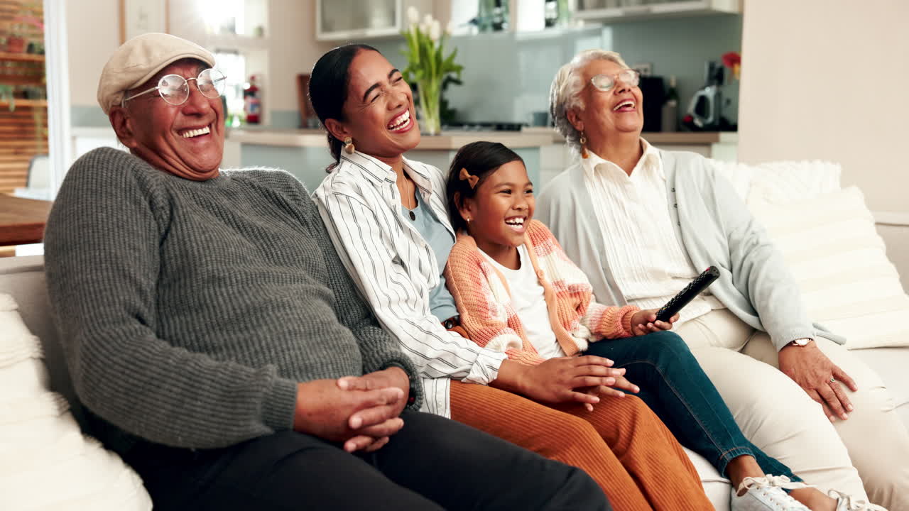 Happy family watching TV together