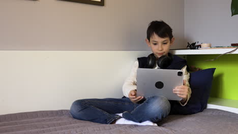 girls using devices on bed