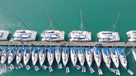 Sailboats-in-the-marina-and-the-city-of-Lefkada-island,-Greece