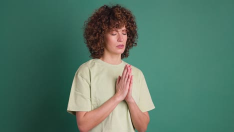 woman praying with closed eyes to god asking for blessing, help, forgiveness