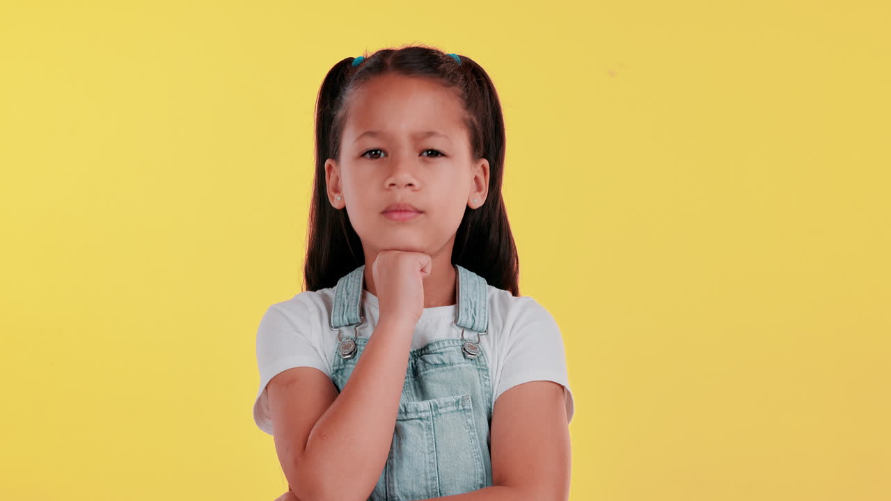 Pensive young girl in studio shot