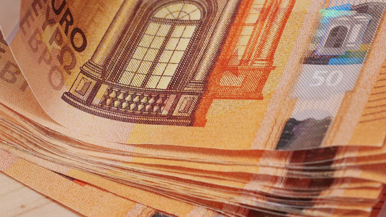 Fifty euro banknotes close-up. European currency EUR, EU Central Bank. 50 euro money macro. Economy, financial and banking concept in European union.