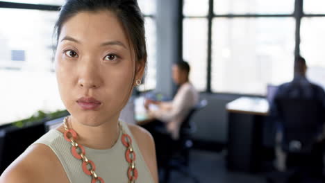portrait of asian businesswoman in office, slow motion, copy space