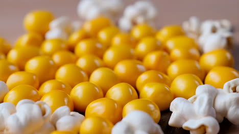 close-up of popcorn kernels and popped popcorn