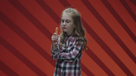 girl eating a carrot