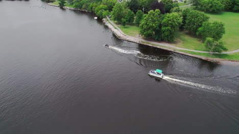 aerial, high altitude orbit video of 2 boats traversing the providence river in providence, ri