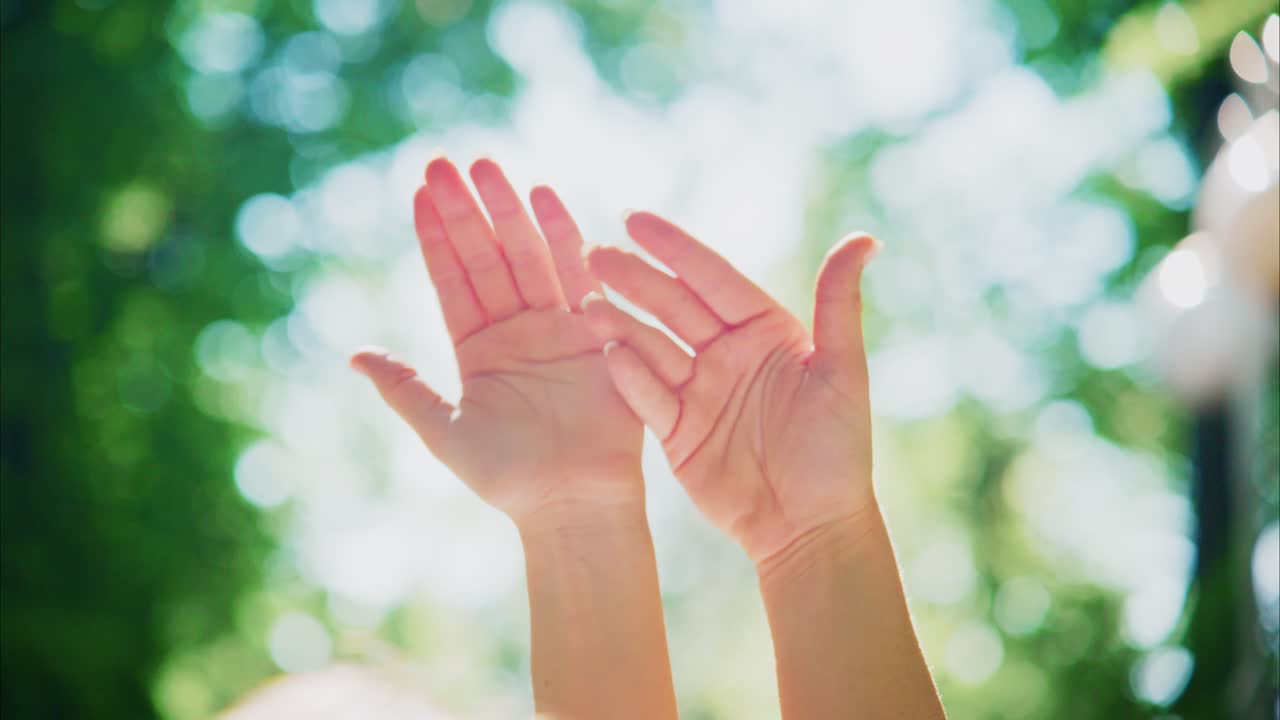 Graceful Movement of Woman's Hands in Sunlight and Nature