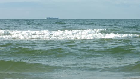 A-woman-having-energy-to-run-in-the-ocean-waves-as-a-relaxation