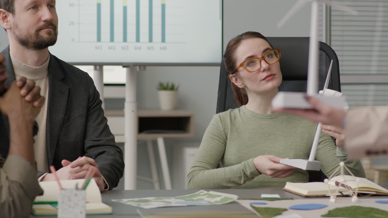 Multiethnic Business Team Discussing About Renewable Energy Project In The Office 7