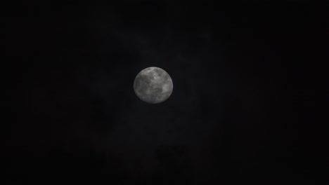 Full-moon-disappearing-in-the-clouds