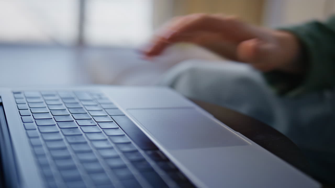 Student finger pressing button using laptop in cabinet. Unknown man working