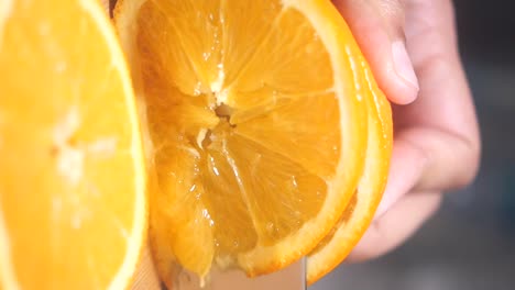 sliced oranges and hand