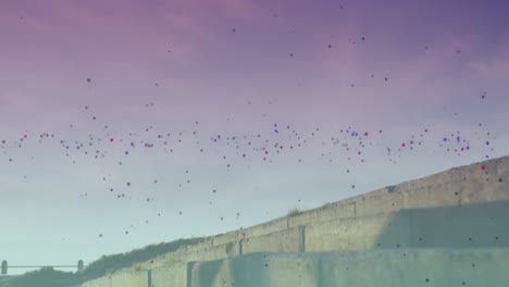 manchas coloridas flotando contra la mujer afroamericana en forma corriendo por las escaleras al aire libre