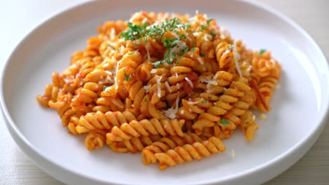 spiral or spirali pasta with tomato sauce and cheese - italian food style