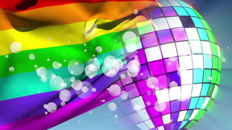 rainbow pride flag being animated waving in scene with mirrored disco ball and floating light orbs