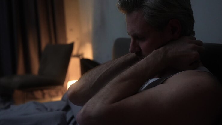 Man in the bedroom at night