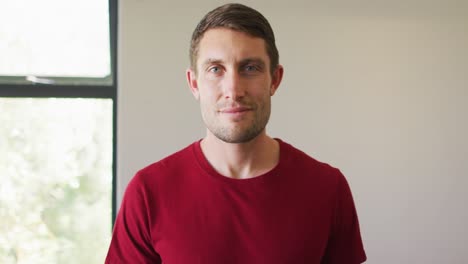 Portrait-of-happy-caucasian-man-spending-time-alone-at-home