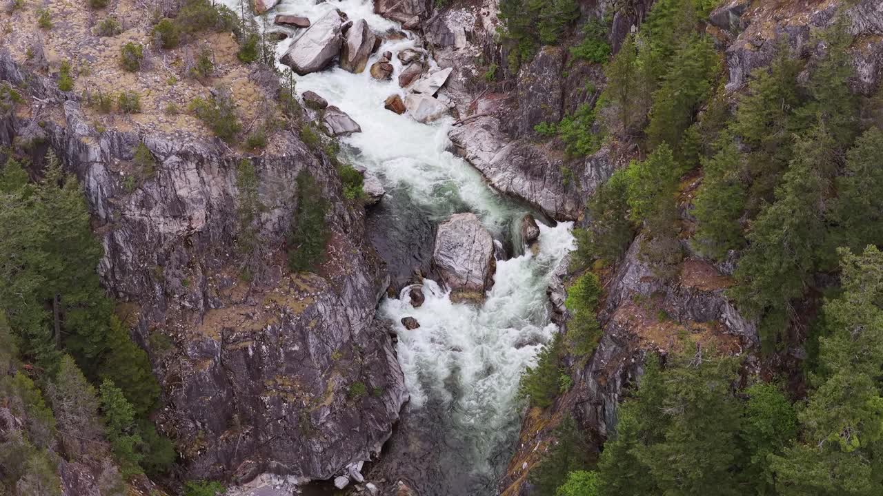 Aerial View of a Powerful River Rushing Through a Deep Rocky Canyon in British Columbia, Canada