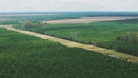 Drone-approaching-high-voltage-towers-in-Corrientes,-Argentina