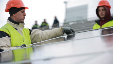 vinnitsa, ukraine - november 2017: solar panel technician installing solar panels