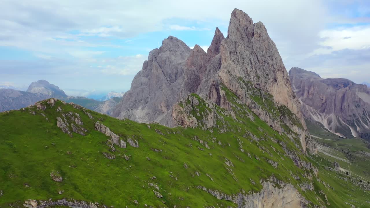Flight over Seceda mountain in the Dolomites in summer, aerial