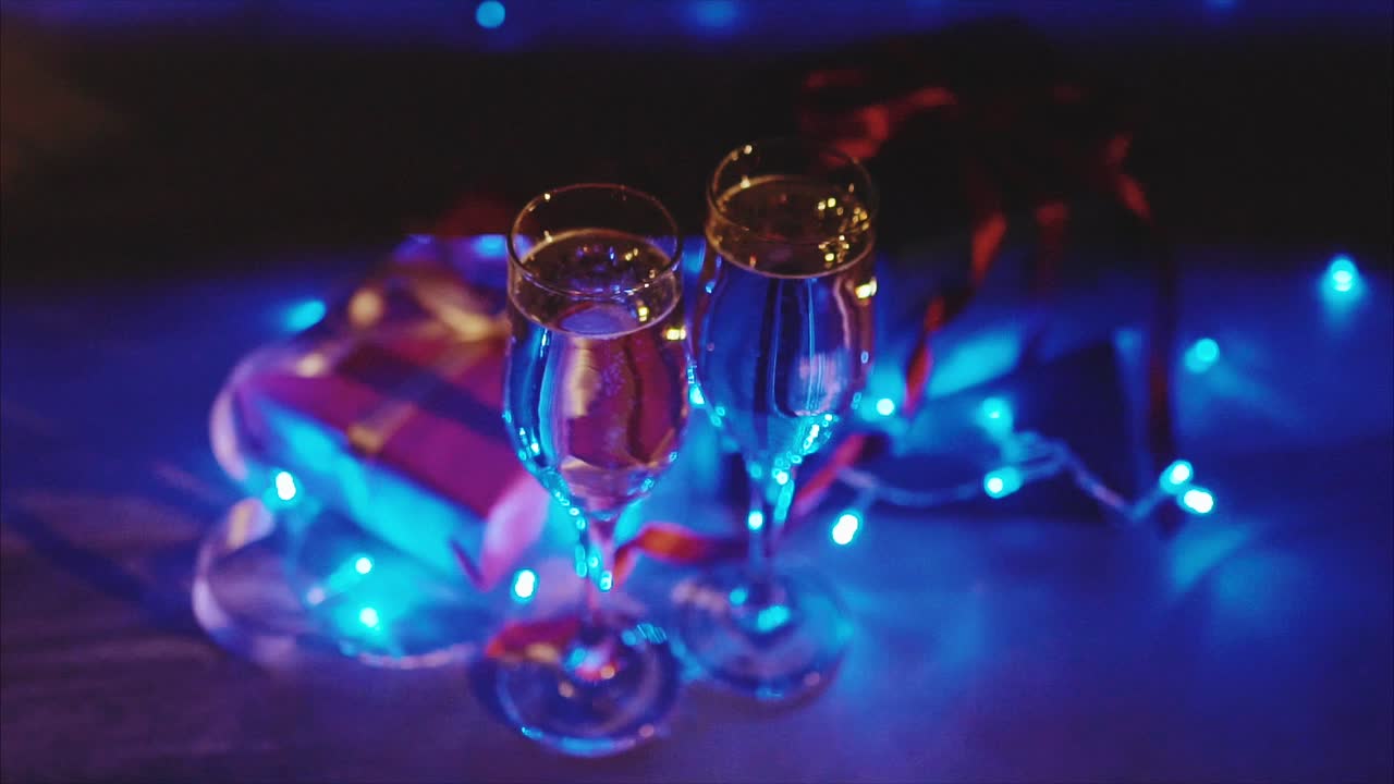 Champagne and Gifts under Blue Lights