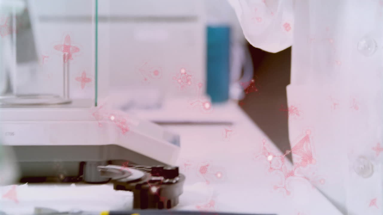 Laboratory equipment with pink floral animation overlay on white surface