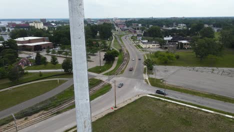 An-old-smokestack,-now-decommissioned,-viewed-through-an-Aerial-Jib-motion