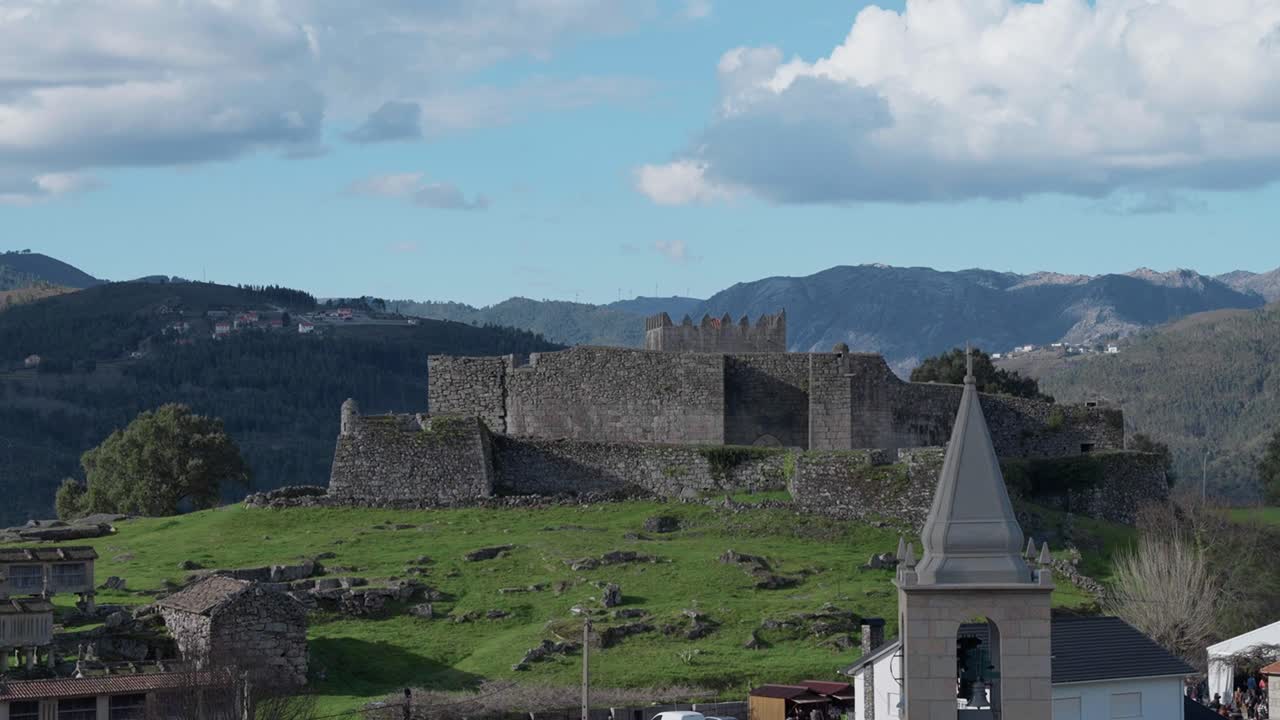 Historic Lindoso castle and church tower with mountains in Alto Minho Portugal