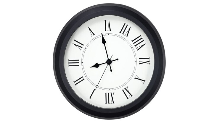 Close-up looping time lapse of a old-fashioned antiquated wall clock with roman numerals