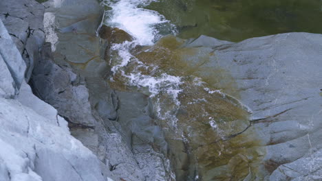 Lone-Coho-Salmon-bravely-fights-through-shallow-water-up-small-waterfall