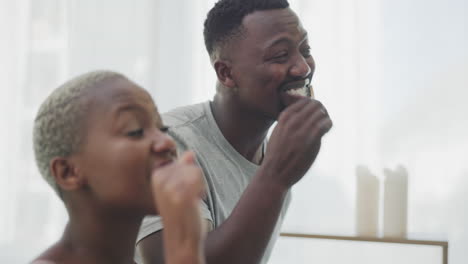 Black-couple,-brushing-teeth