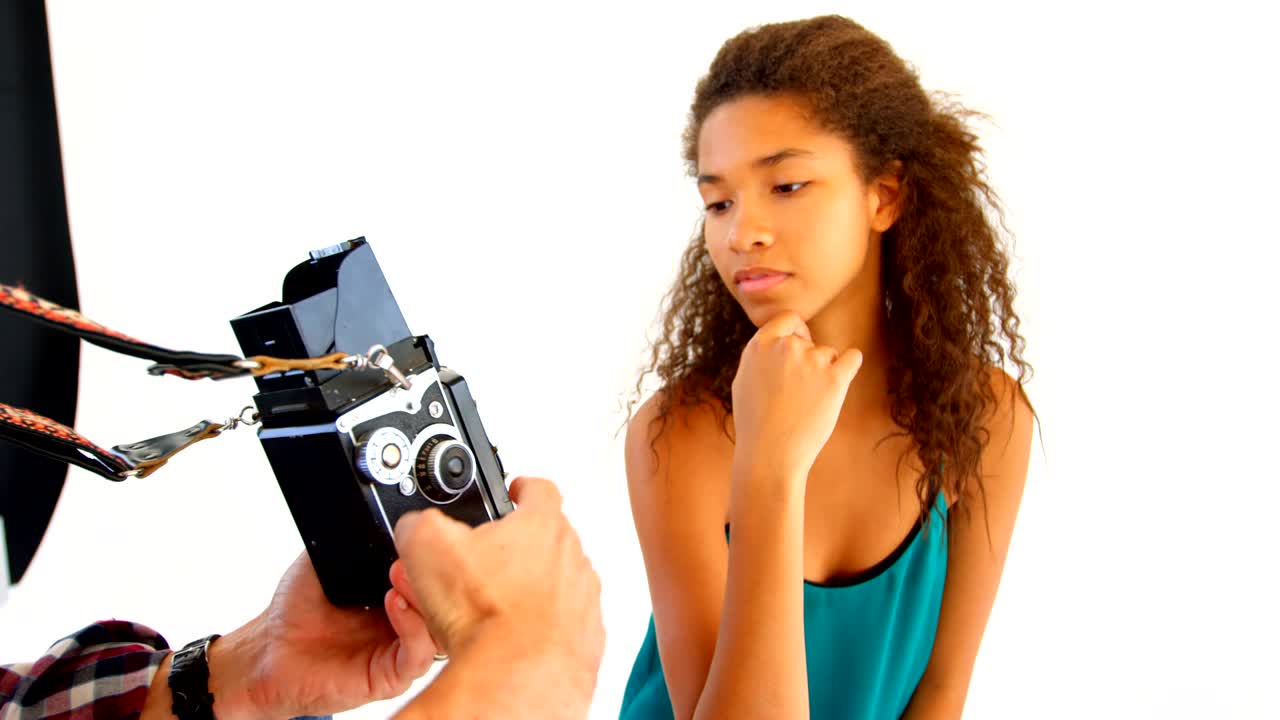 Male photographer and model discussing over photos 4k