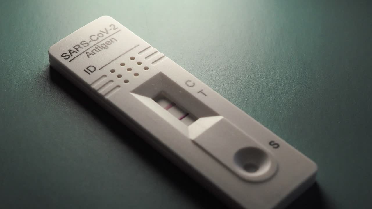 Rapid Antigen Test for self-diagnostic SARS-CoV-2, Covid-19, Coronavirus. Positive test result. Scene A