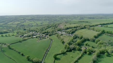 aerial view over lush green fields in rural britain