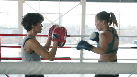 women's boxing training session in gym