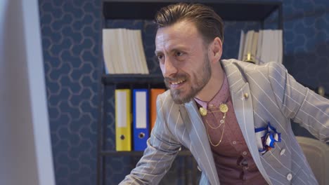 elegant and stylish businessman using computer rejoices, financial statement results, project completion.