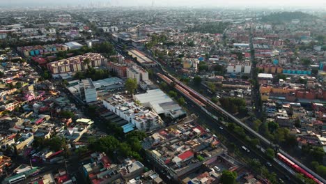 Cityscape-of-north-Mexico-city-main-road-with-vehicle,-aerial-drone-establishing-shot,-traveling-right