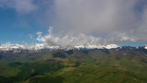 Elbrus-Region.-Flying-over-a-highland-plateau.-Beautiful-landscape-of-nature.-Mount-Elbrus-is-visible-in-the-background.