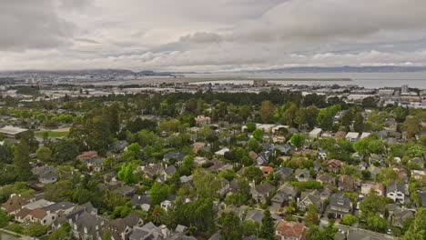 burlingame california aerial v1 cinematic flyover easton addition neighborhood towards sfo airport capturing picturesque homes with tree lined streets and bay view - shot with mavic 3 cine - june 2022