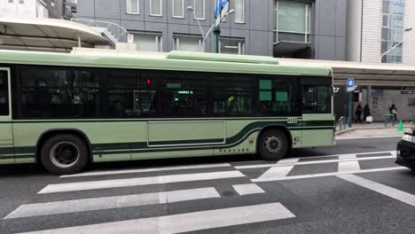 vehicles and pedestrians at a busy intersection