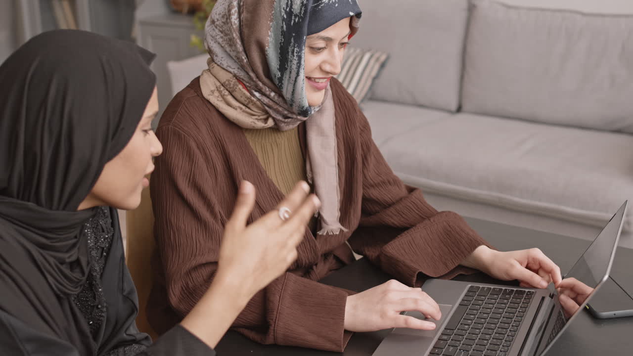 Muslim Women Working on Laptop