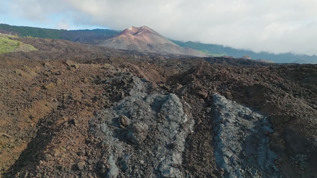 Land covered by solidified lava flows coming from new volcano, aerial