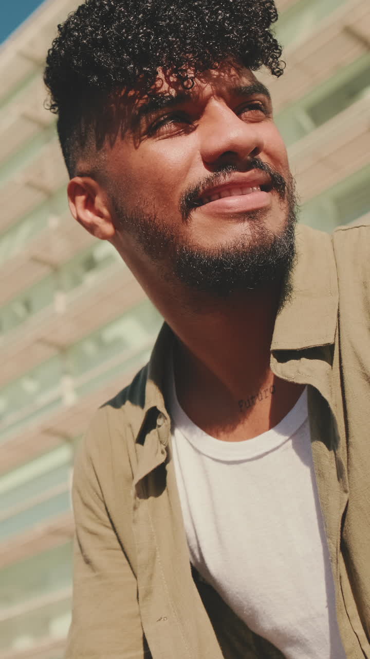 Portrait of a man with curly hair and beard