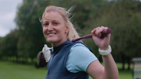 a woman golfer holding a golf club