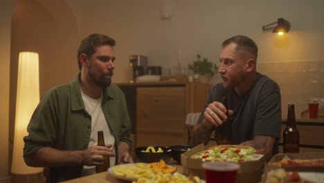 friends enjoying dinner and drinks at home